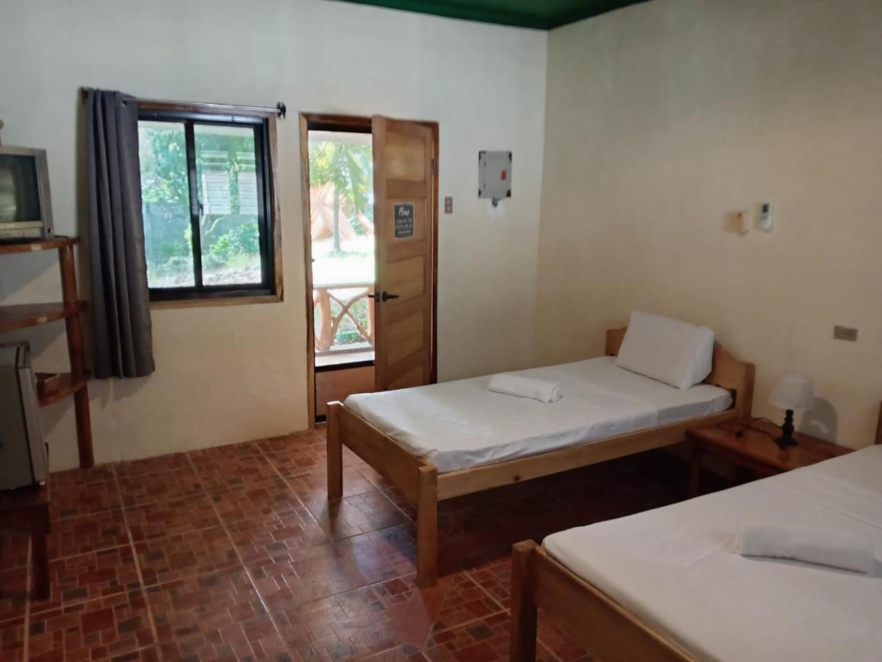 Chelle'S Guesthouse And Backpackers Siquijor Bagian luar foto