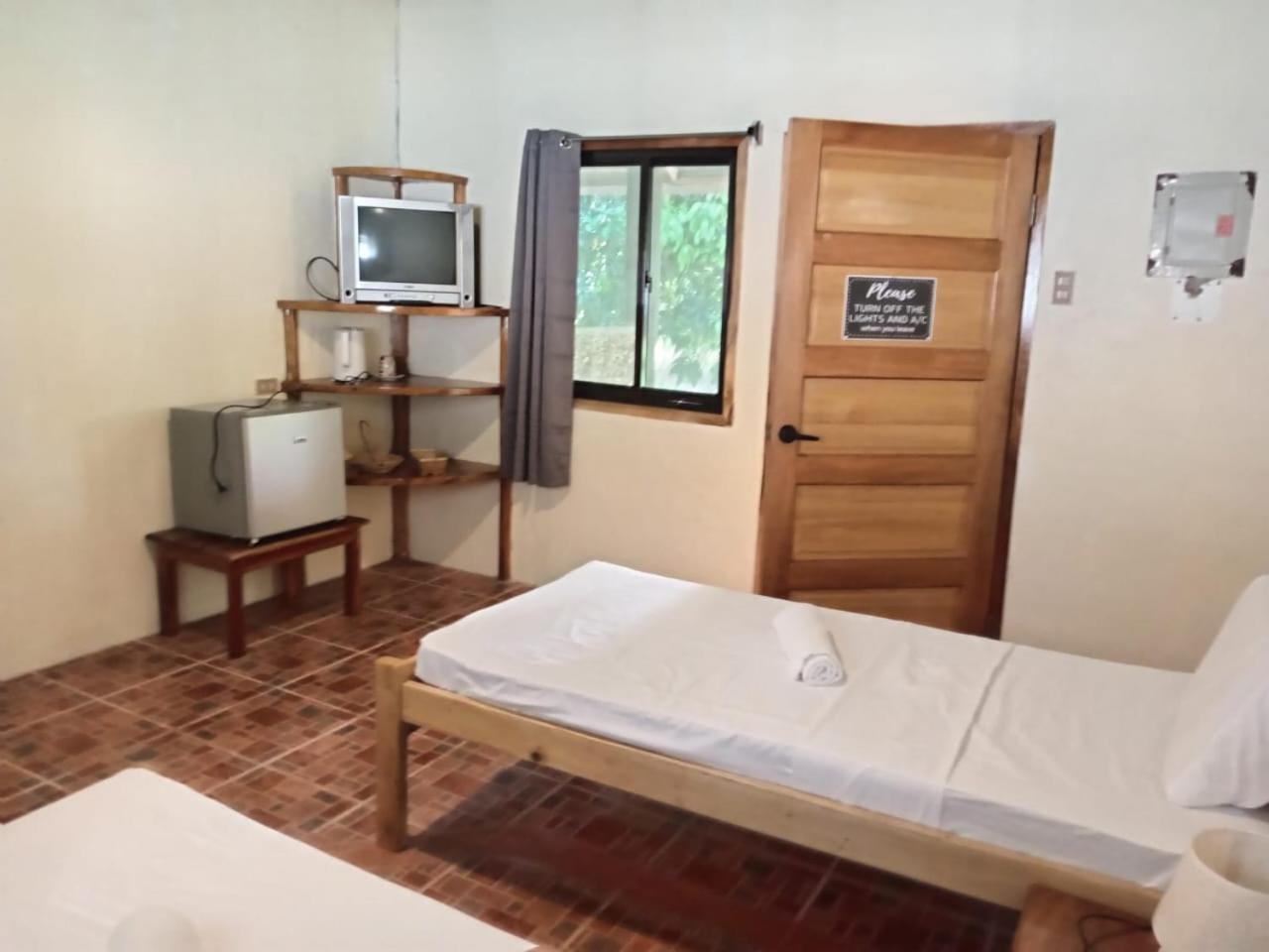 Chelle'S Guesthouse And Backpackers Siquijor Bagian luar foto